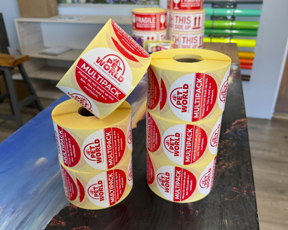 Roll of red and white Pet World multipack labels, flexo printed